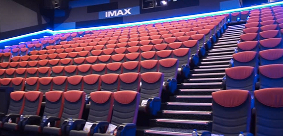 IMAX auditorium seating in blue-lit rows