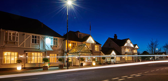 County Hotel's timber-framed exterior illuminated at night