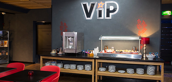 VIP concession counter with an espresso machine and snacks