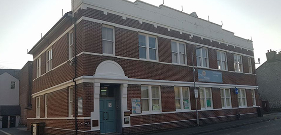 Clwyd Chambers' red brick exterior with workspace signage