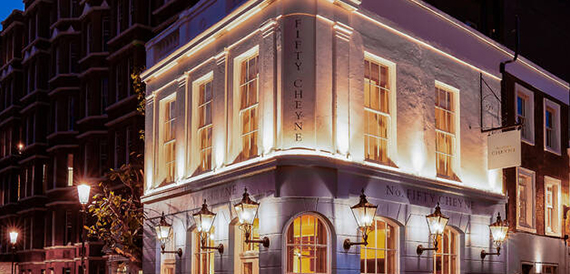 No. Fifty Cheyne's white corner exterior illuminated at night
