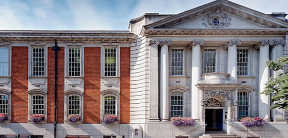 Chelsea Old Town Hall's red brick and white stone exterior with a columned portico