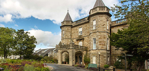 Turreted stone exterior of the hotel building