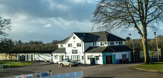 Chepstow Racecourse's white pavilion building with a black roof