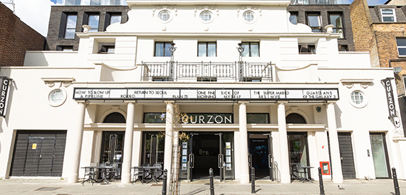 Curzon's columned stone facade with a film title marquee above the entrance