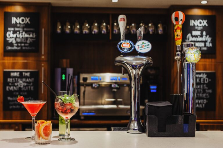INOX bar counter with beer taps and two cocktails on display