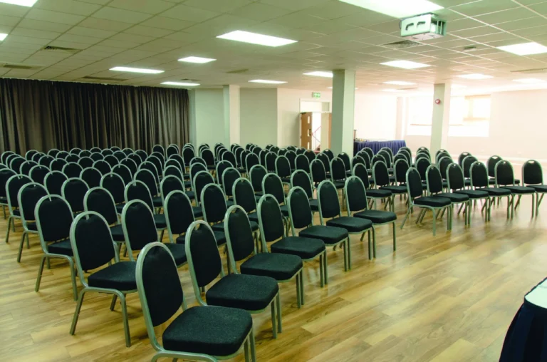 First Floor Hall set theatre-style with rows of green chairs