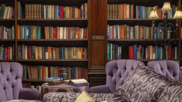 Room with bookshelves and seating at Thackray House